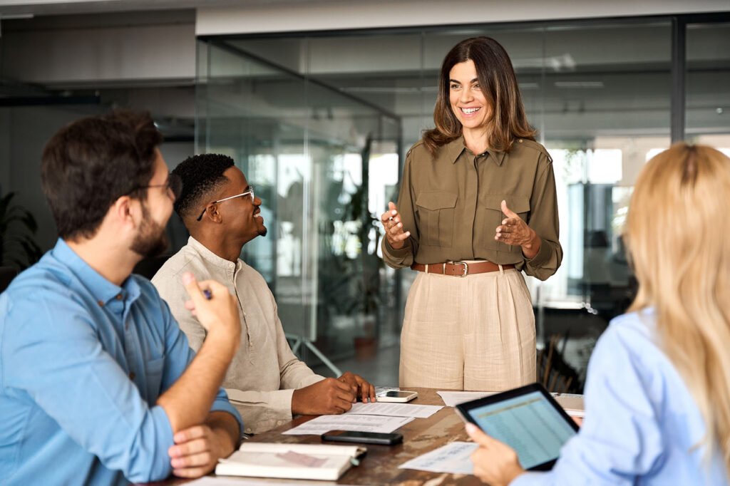 Business meeting with diverse professionals discussing strategy, engaged in collaboration, and focused on growth.